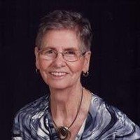 Smiling elderly woman with glasses and short hair
