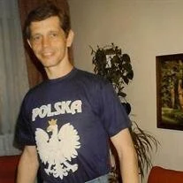 Person wearing Polska shirt with white eagle design.