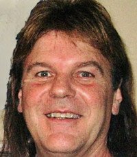 Smiling person with medium-length hair