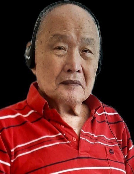 Man in red striped shirt and headphones