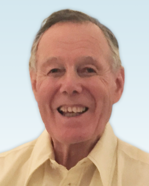 Smiling older man in a light-colored shirt