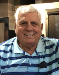 Smiling older man in blue striped shirt