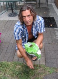 Man planting seeds in garden