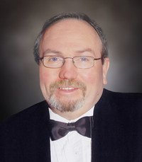OGLE, Robert Douglas Ogle Man in tuxedo and bow tie smiling