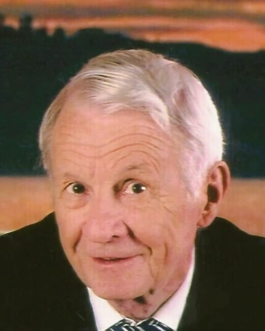 Elderly man smiling in sunset background.