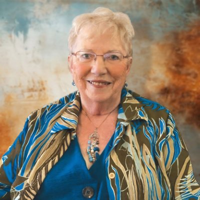 Elderly woman smiling in colorful blazer
