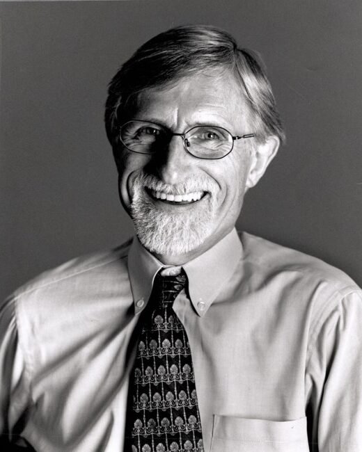 Smiling man in glasses and tie