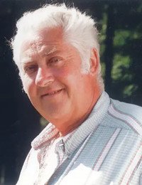 Smiling older man with gray hair outdoors