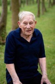 Elderly man smiling in a park