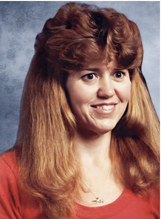 MARCHAND, Sharon Marchand Smiling woman with long hair in a red shirt.
