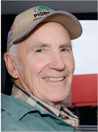 BALL, Murray Gordon Ball Elderly man smiling, wearing cap in vehicle