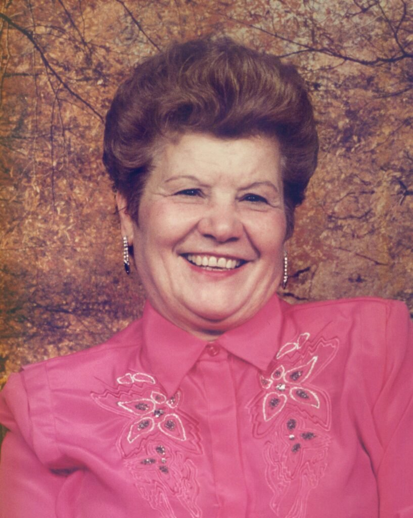 Smiling woman in pink blouse portrait