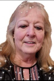 Smiling woman with sparkles around her face