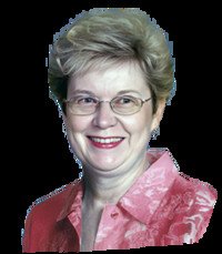 Smiling person in glasses and pink shirt portrait