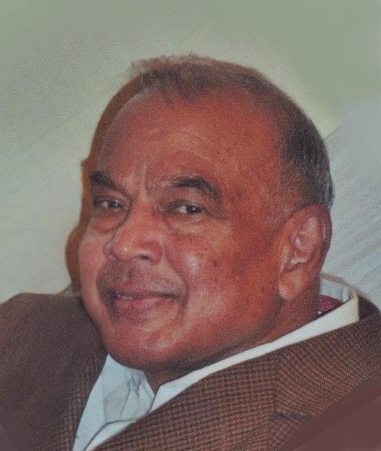 Smiling man in tweed jacket close-up portrait.