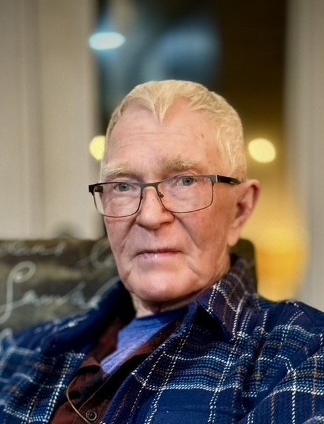 EDWARDS, Harold Edwards Elderly man with glasses and plaid shirt sitting.