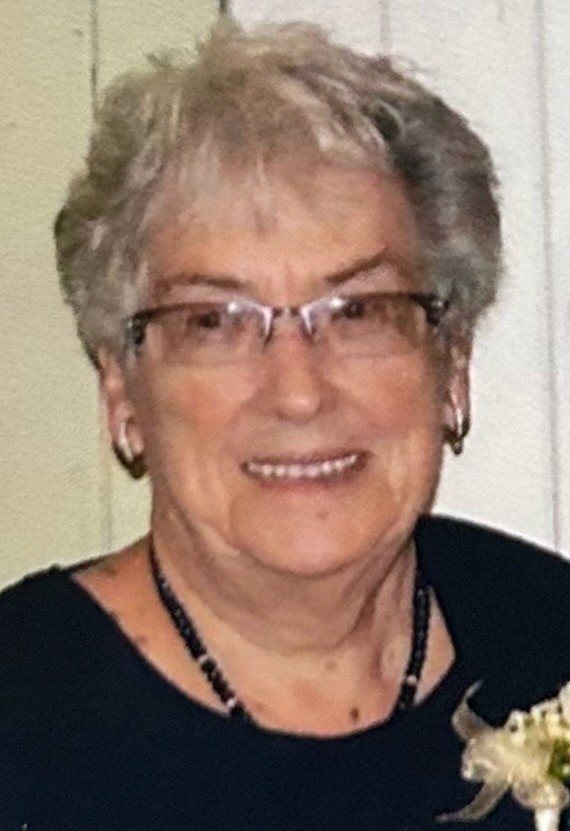 WINTERS, Arvilla Winters Smiling elderly person with glasses and floral boutonniere.