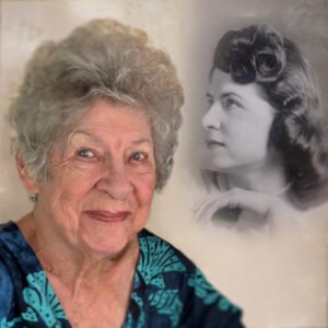 Smiling elderly woman with vintage photo.