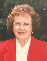 Elderly woman in red blazer, outdoor portrait