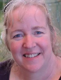 Smiling woman outdoors, close-up portrait
