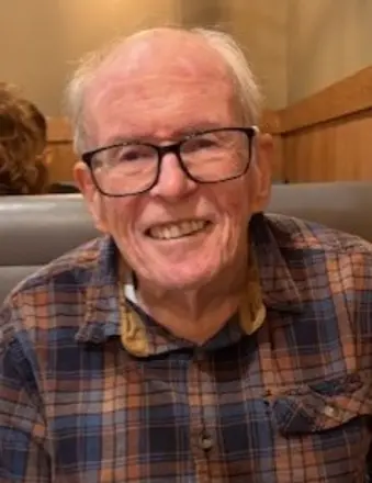 MACKAY DDS, Danford Royce MacKay DDS Smiling elderly man in plaid shirt at restaurant