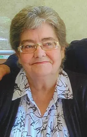 Smiling elderly woman with glasses and short hair