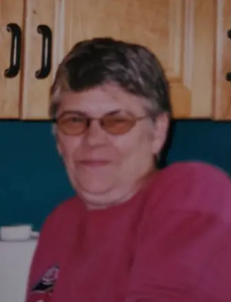 Person smiling in retro kitchen setting