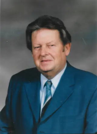 Man in blue suit and tie portrait