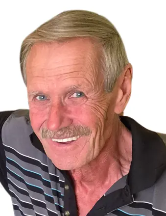 Smiling man in striped polo shirt