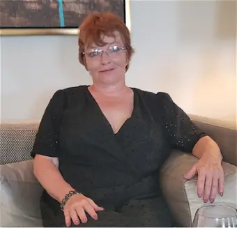 Person sitting on a couch indoors