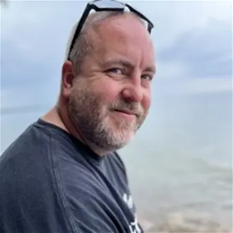 Smiling man by the ocean