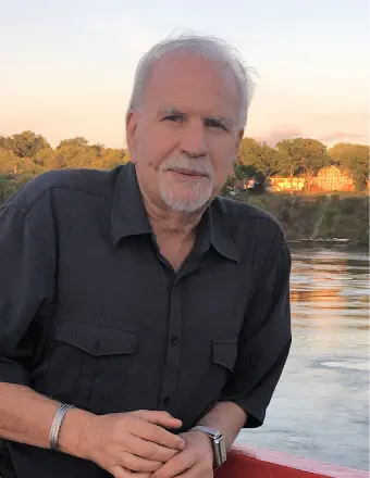 LANDEN, John Landen Man by river at sunset