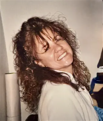 SPEZIALE, Tamara Billy-Jo Speziale Smiling woman with curly hair indoors