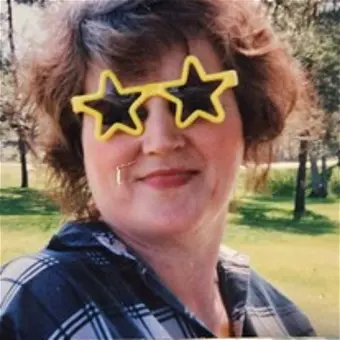 Person wearing star-shaped sunglasses outdoors