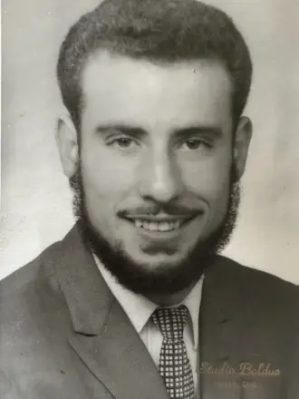 Smiling man wearing suit and tie portrait.