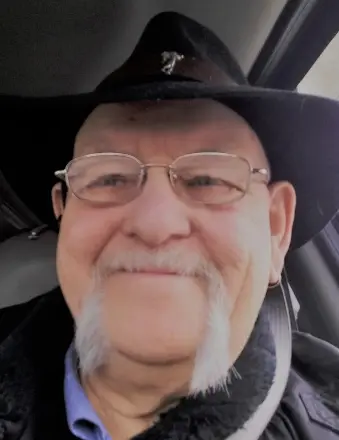 Smiling man in hat and glasses selfie