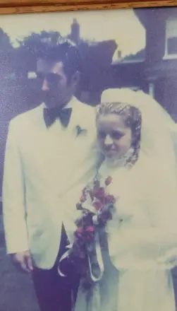Vintage wedding couple outside on their special day.