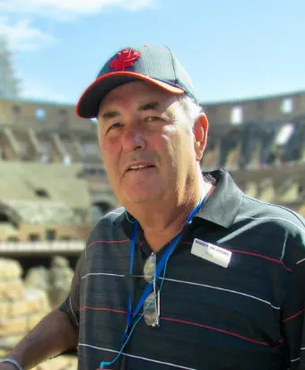 Man wearing a cap at ancient amphitheater