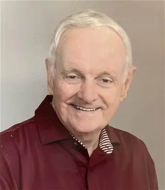 Smiling elderly man in red shirt