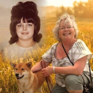 Smiling woman with dog in a field