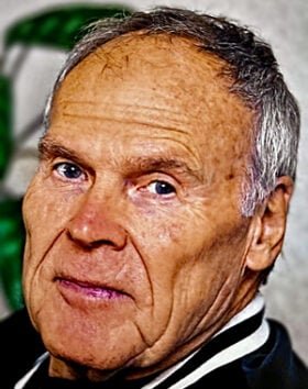 Senior man with short gray hair and serious expression