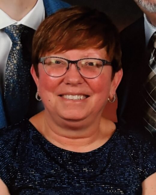Smiling woman with glasses at event