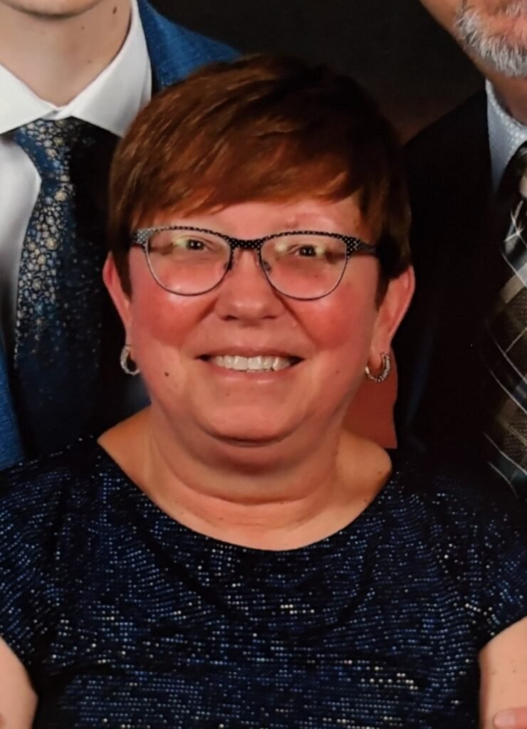 ANNE, TURNER Lori Anne “LAT” Smiling woman with glasses at event