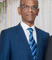 Man in blue suit and striped tie