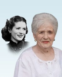 Elderly woman with younger version photo in background.