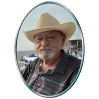 Man wearing cowboy hat outdoors
