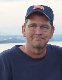 ROWLEY, Wayne Rowley Man in blue cap and shirt outdoors