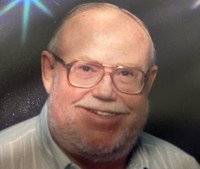 Smiling elderly man with glasses and beard