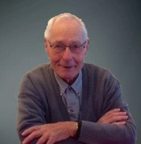 LEHMAN, William Lehman Elderly man with glasses and gray sweater smiling.