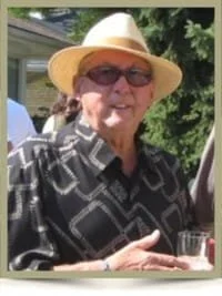 Man in hat and sunglasses outdoors